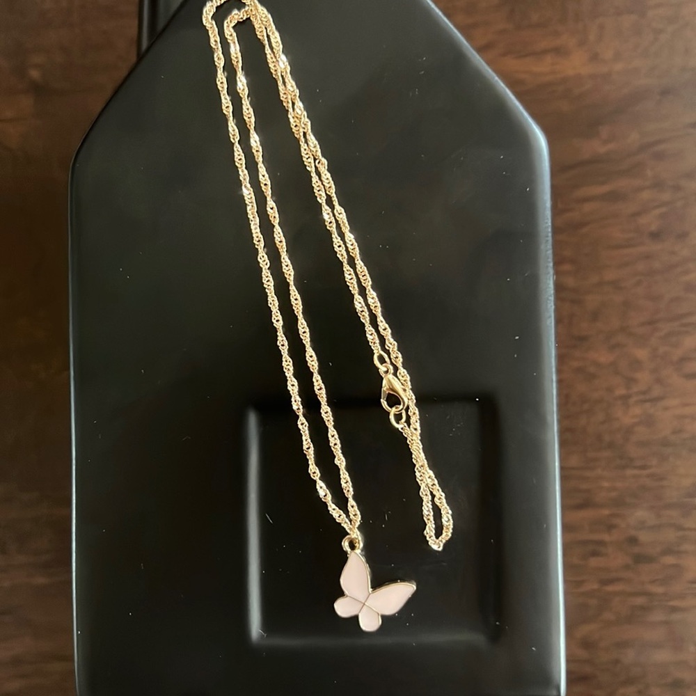 Adorable pink butterfly necklace on gold-toned delicate chain​